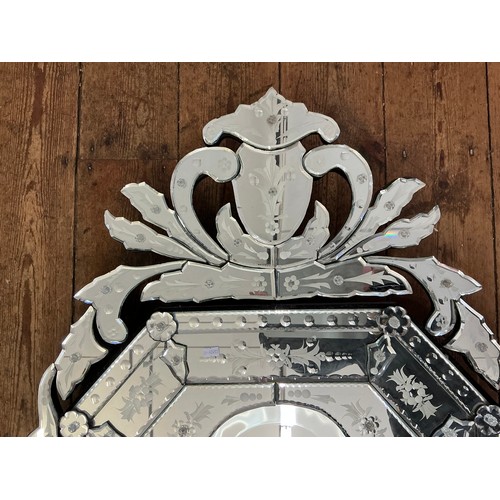 688 - An Italian design Cut Glass Venetian Effect Mirror with engraved Frosted Decoration. Measuring: 143c... 