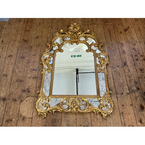 689 - A Large Rococo design Scroll & Shell Entrance Hall Mirror with panelled sides. Measuring: 90cms x 13... 