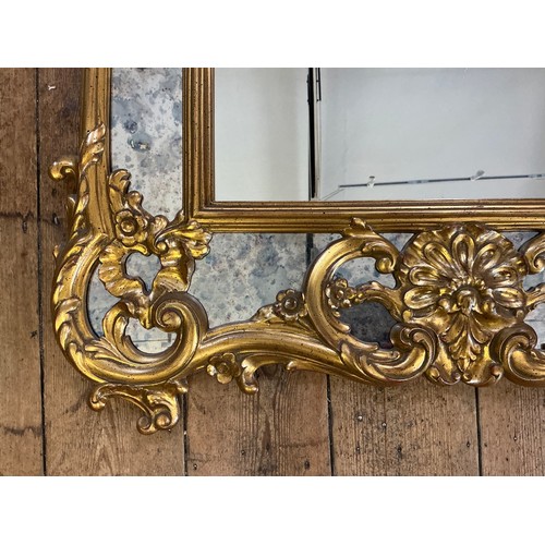 689 - A Large Rococo design Scroll & Shell Entrance Hall Mirror with panelled sides. Measuring: 90cms x 13... 