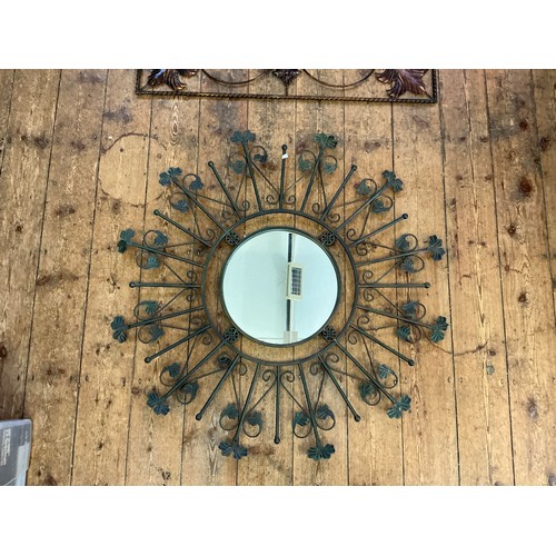 690 - A Metal Circular & Radiating Wall Mirror & a Decorative Floral Applique. Measuring: 103cms x 103cms.