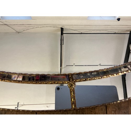 691 - A Metal Effect Oval Wall Mirror with inset Central Looking Glass. Measuring: 103cms.