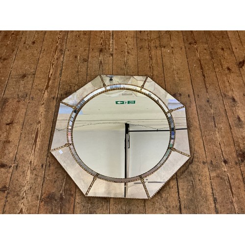 692 - A Metal Effect Octagonal Wall Mirror with inset Central Looking Glass. Measuring: 74cms.