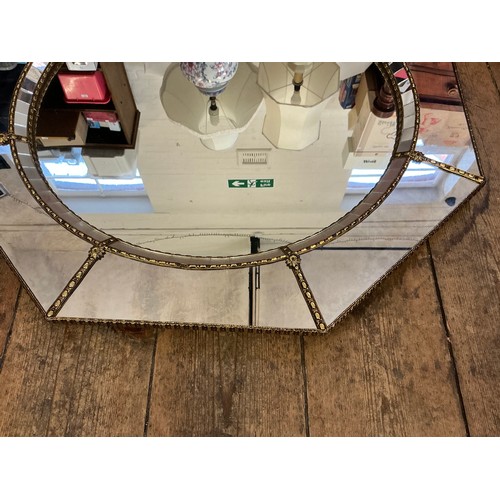 692 - A Metal Effect Octagonal Wall Mirror with inset Central Looking Glass. Measuring: 74cms.