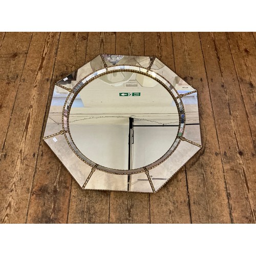692 - A Metal Effect Octagonal Wall Mirror with inset Central Looking Glass. Measuring: 74cms.