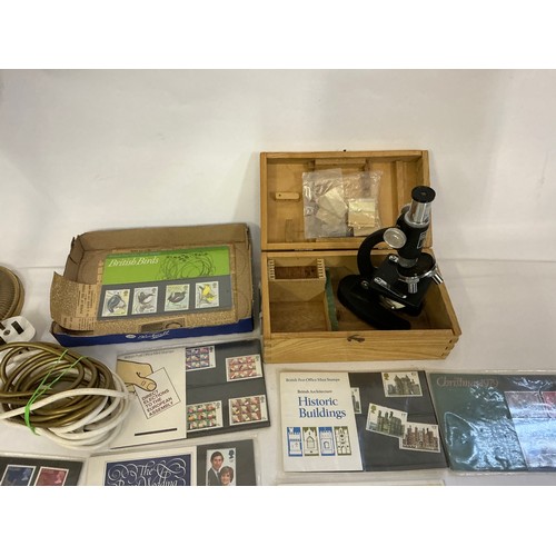 694 - A Vintage Brass effect Students Lamp with a Smokey Glass shade, a Microscope & a quantity of First D... 