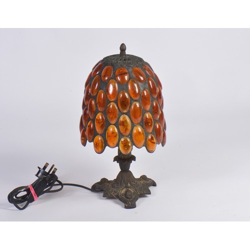 696 - An Indian made Table Lamp decorated with 'Amber' beads. Measuring: 35cms high.