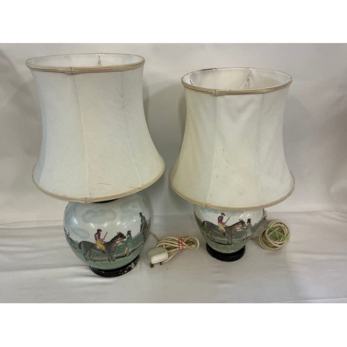 699 - Two Chinese Porcelain Table Lamps decorated with Equestrian Subjects. Measuring: 26cms High.