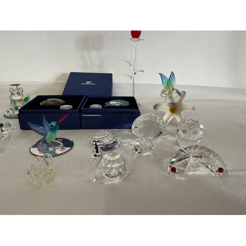 713 - A Collection of 16 Swarovski Glass figurines, two with Original Boxes.