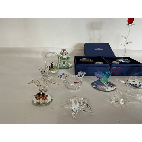 713 - A Collection of 16 Swarovski Glass figurines, two with Original Boxes.