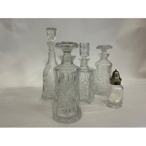 718 - A Collection of Four Decanters.