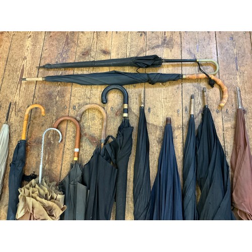 745 - A Collection of 14 various Vintage Umbrellas.