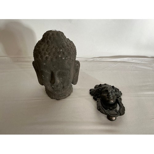 881 - A Bronze Door Knocker of a Young Ladies Head & a Pottery Temple God Head.
