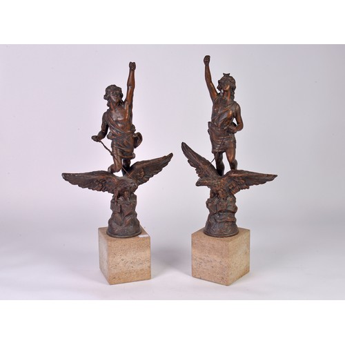 882 - A Pair of French Spelter Victoire on Eagle Statuettes on Limestone Bases. Measuring: 51cms High.