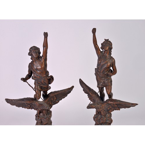 882 - A Pair of French Spelter Victoire on Eagle Statuettes on Limestone Bases. Measuring: 51cms High.