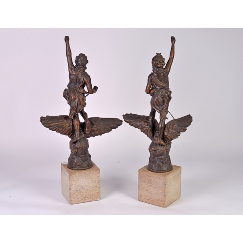 882 - A Pair of French Spelter Victoire on Eagle Statuettes on Limestone Bases. Measuring: 51cms High.