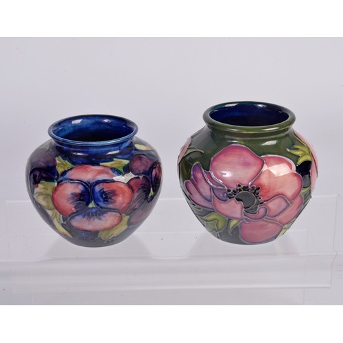 890 - A Moorcroft Pottery Squat Vase & one other decorated with Flowers. Measuring: 7cms.