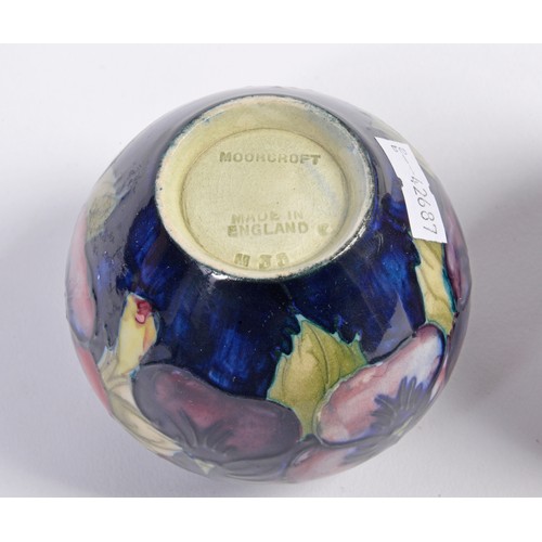 890 - A Moorcroft Pottery Squat Vase & one other decorated with Flowers. Measuring: 7cms.