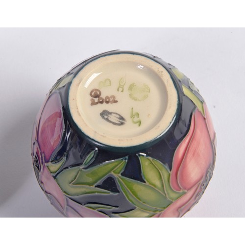 890 - A Moorcroft Pottery Squat Vase & one other decorated with Flowers. Measuring: 7cms.