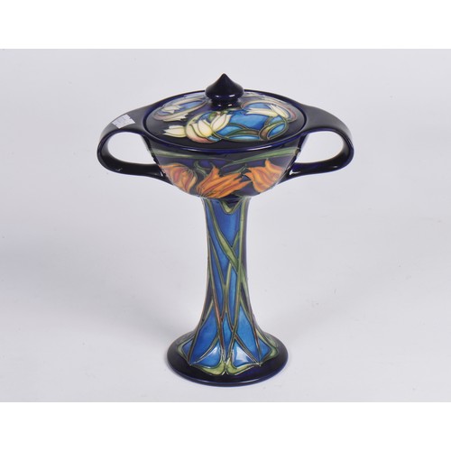 895 - A Moorcroft Pottery bonboniere in the Loch Hope pattern, having Twin Handles to a slender body & fla... 