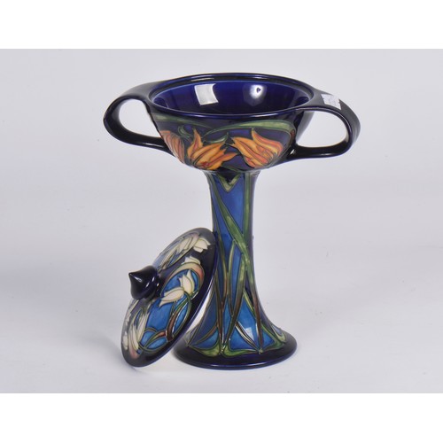 895 - A Moorcroft Pottery bonboniere in the Loch Hope pattern, having Twin Handles to a slender body & fla... 