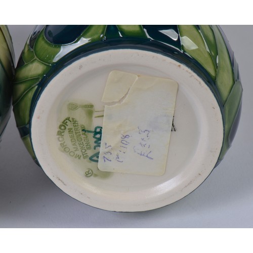 896 - Three various Moorcroft Pottery Vases decorated with Flowers Complete with Two Boxes & Paperwrork. M... 