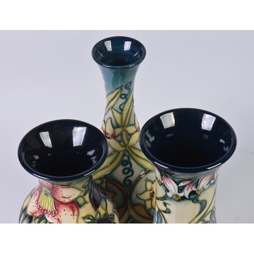 896 - Three various Moorcroft Pottery Vases decorated with Flowers Complete with Two Boxes & Paperwrork. M... 