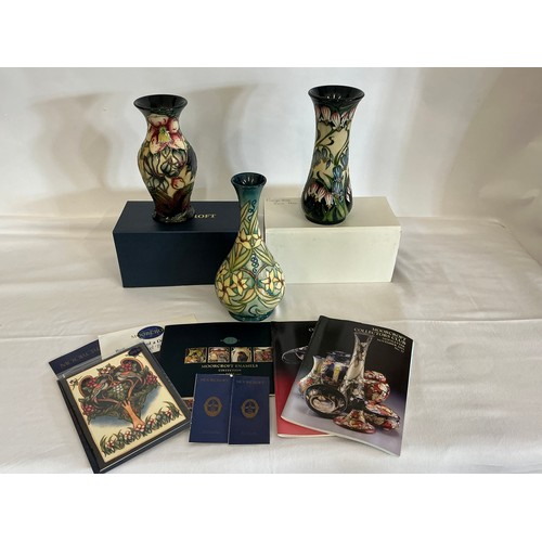 896 - Three various Moorcroft Pottery Vases decorated with Flowers Complete with Two Boxes & Paperwrork. M... 