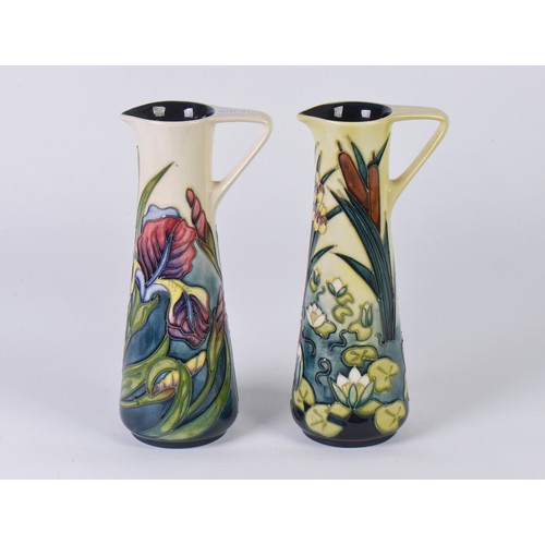 897 - Two White Ground Moorcroft pottery Ewer Jugs Complete with One Box & Paperwork. Measuring: 24cms hig... 