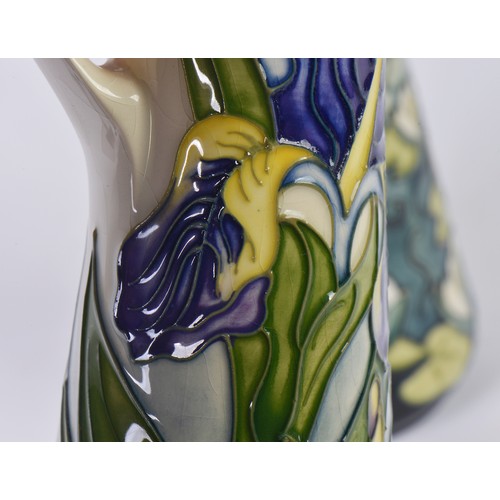 897 - Two White Ground Moorcroft pottery Ewer Jugs Complete with One Box & Paperwork. Measuring: 24cms hig... 