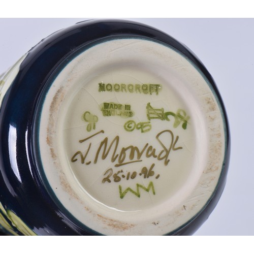 897 - Two White Ground Moorcroft pottery Ewer Jugs Complete with One Box & Paperwork. Measuring: 24cms hig... 