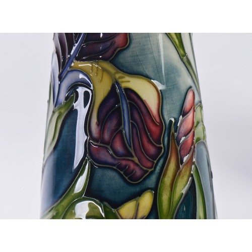 897 - Two White Ground Moorcroft pottery Ewer Jugs Complete with One Box & Paperwork. Measuring: 24cms hig... 