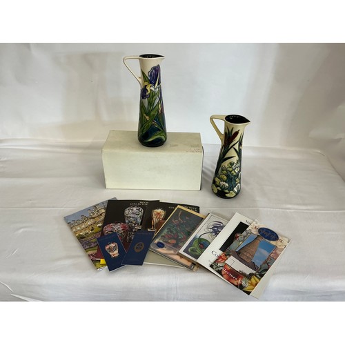 897 - Two White Ground Moorcroft pottery Ewer Jugs Complete with One Box & Paperwork. Measuring: 24cms hig... 