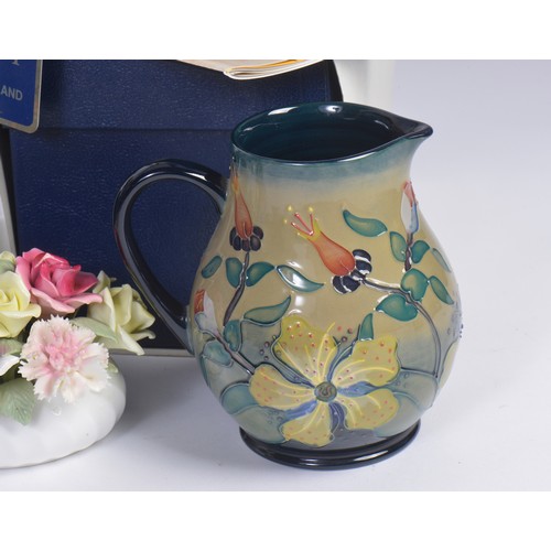 898 - Two Moorcroft Pottery Jugs Complete with Boxes & Paperwork, a Moorcroft Book, etc.