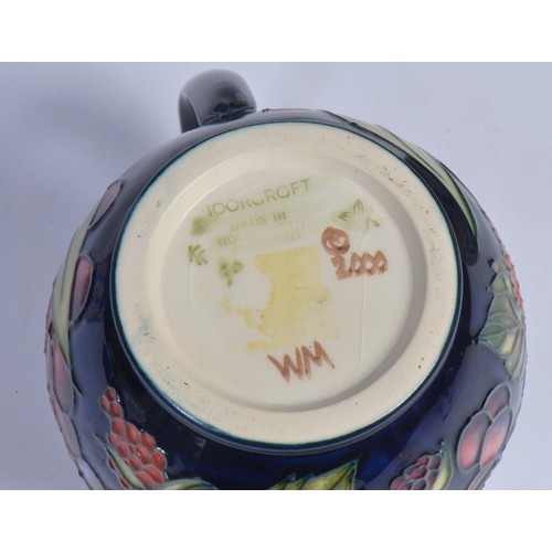 898 - Two Moorcroft Pottery Jugs Complete with Boxes & Paperwork, a Moorcroft Book, etc.