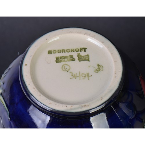 900 - Four various Moorcroft Vases. Measuring: 15cms High. (Highest).