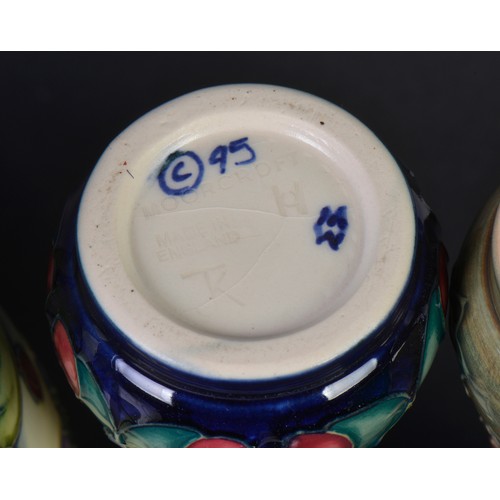 900 - Four various Moorcroft Vases. Measuring: 15cms High. (Highest).