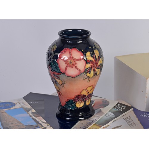 902 - A Moorcroft Blue Glazed Candlestick & a similar Fuchsia designed Vase Complete with Boxes & Paperwor... 