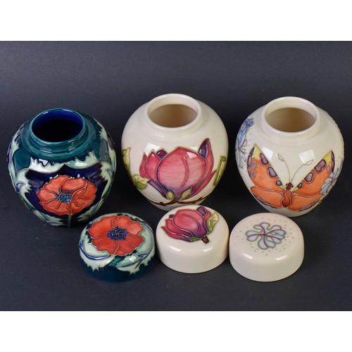 903 - Three various Moorcroft Ginger Jars & Covers. Measuring: 11cms High.