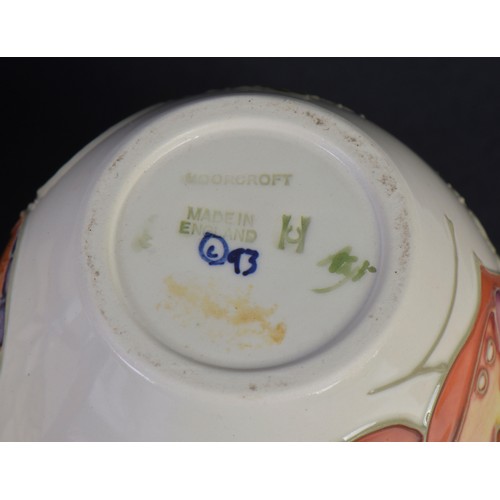 903 - Three various Moorcroft Ginger Jars & Covers. Measuring: 11cms High.