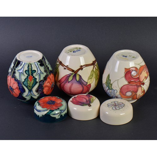 903 - Three various Moorcroft Ginger Jars & Covers. Measuring: 11cms High.