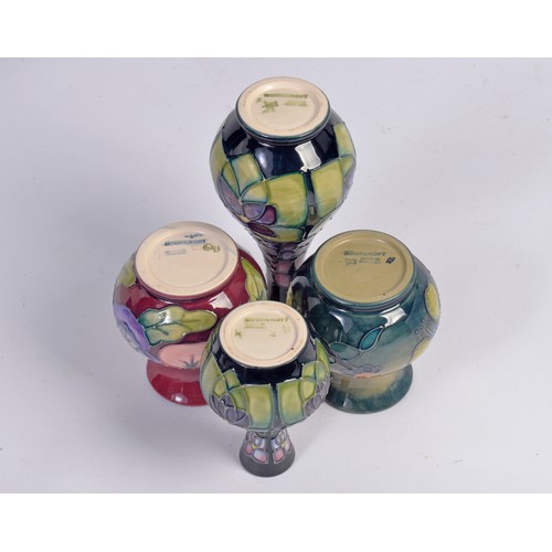 907 - Four various Moorcroft Vases Complete with Original Boxes & Paperwork. Measuring: 18cms. High. (High... 