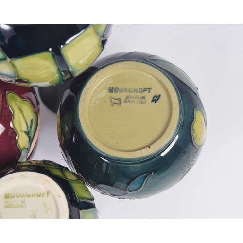 907 - Four various Moorcroft Vases Complete with Original Boxes & Paperwork. Measuring: 18cms. High. (High... 