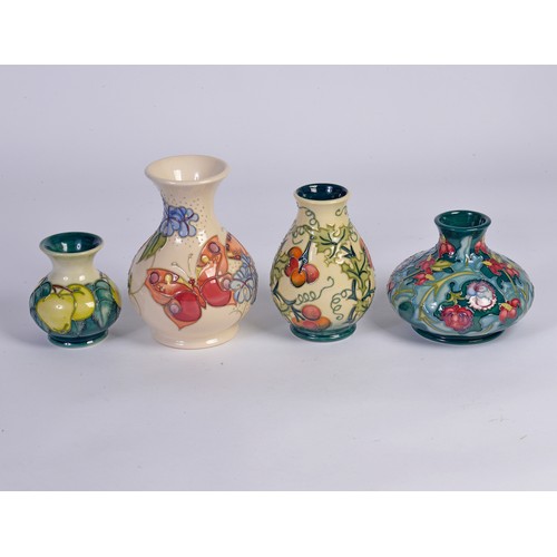 908 - Four various Moorcroft vases of Squat & Flared necked form Complete with the Original Boxes & Paperw... 