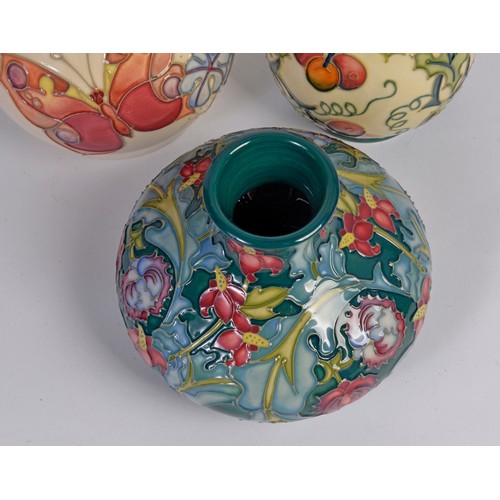 908 - Four various Moorcroft vases of Squat & Flared necked form Complete with the Original Boxes & Paperw... 