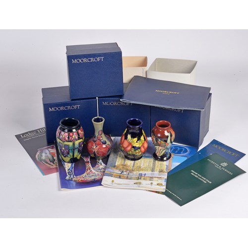 909 - Four various Moorcroft Vases Complete with Original Boxes & Paperwork. Measuring: 10cms High. (Appro... 