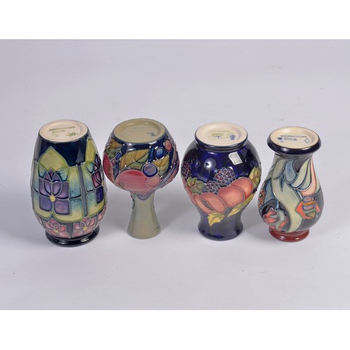 909 - Four various Moorcroft Vases Complete with Original Boxes & Paperwork. Measuring: 10cms High. (Appro... 