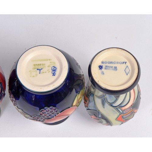 909 - Four various Moorcroft Vases Complete with Original Boxes & Paperwork. Measuring: 10cms High. (Appro... 