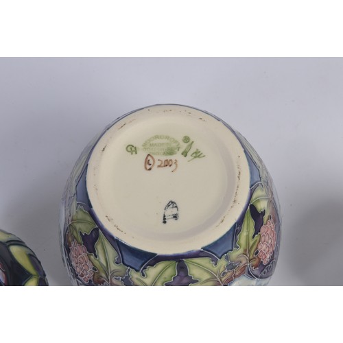 910 - A Grape decorated Moorcroft Ginger Jar & Cover along with Two Smaller Moorcroft Ginger Jars & Covers... 