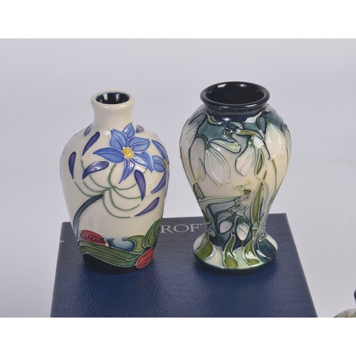911 - Four various Moorcroft Vases Complete with Boxes & Paperwork. Measuring: 9.5cms. (Approx).