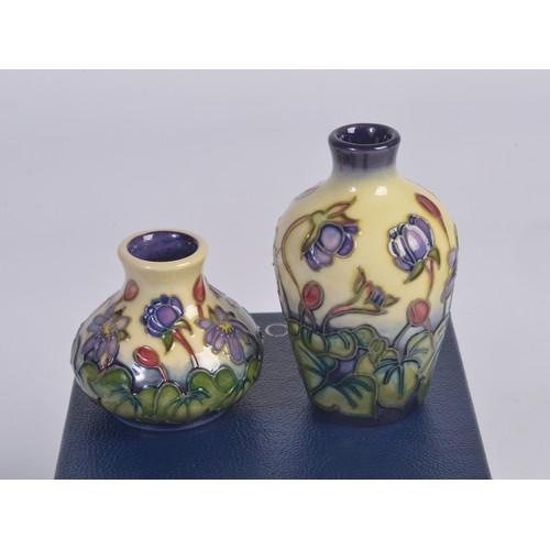 911 - Four various Moorcroft Vases Complete with Boxes & Paperwork. Measuring: 9.5cms. (Approx).